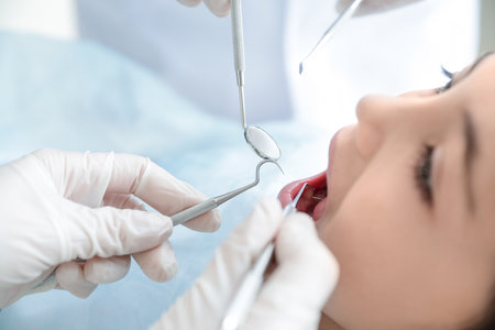 Little girl dentist visiting in clinic, closeupの写真素材