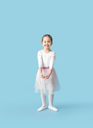 Cute little ballerina on color backgroundの写真素材