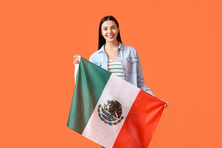 Beautiful young woman with Mexican flag on color backgroundの写真素材