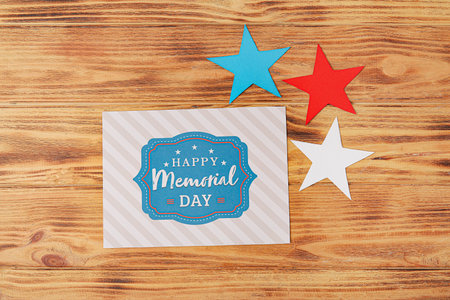 Greeting card for Memorial Day celebration on wooden backgroundの写真素材