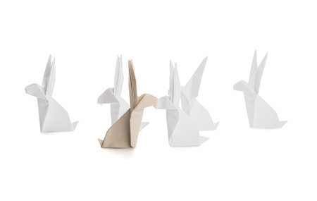 Origami rabbits on white background. concept of uniquenessの写真素材