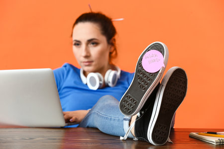 Female programmer and sticker with text WORK HARD on color background