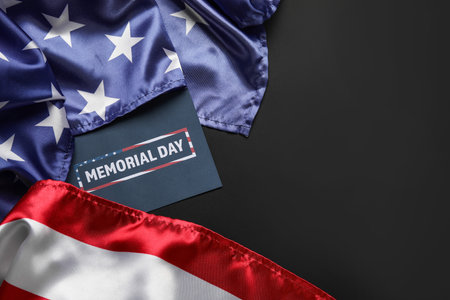 Paper sheet with text MEMORIAL DAY and USA flag on dark backgroundの写真素材