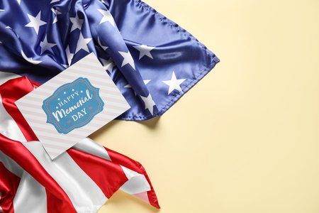 Paper sheet with text MEMORIAL DAY and USA flag on light backgroundの写真素材