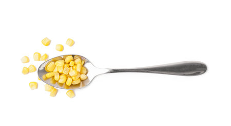 Spoon with canned corn isolated on white backgroundの写真素材