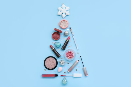 Christmas tree made of cosmetics and decorations on color backgroundの写真素材