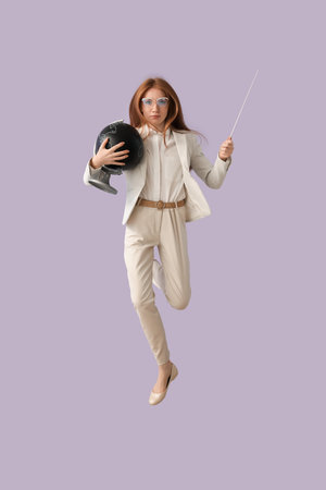 Female Geography teacher with globe and pointer jumping near lilac wall