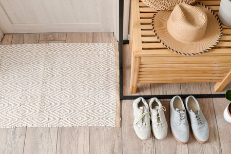 Chest of drawers with soft rug in modern hallの写真素材