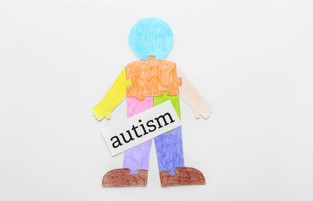 Colorful human figure and word AUTISM on white backgroundの写真素材