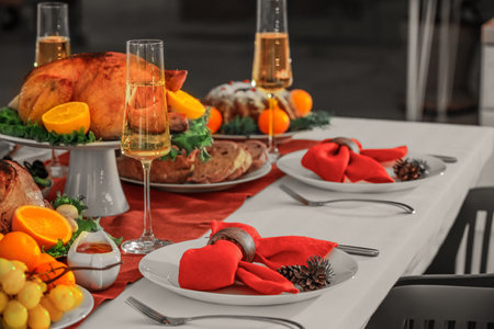 Different tasty dishes for Christmas dinner on tableの写真素材