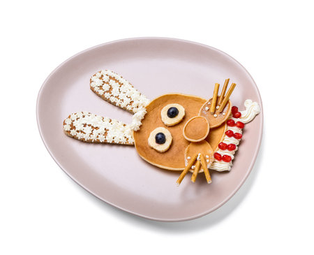 Plate with bunny made of pancakes, fruits and whipped cream on white backgroundの写真素材