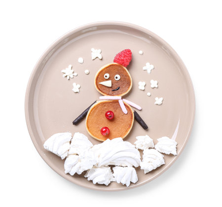 Plate with tasty snowman pancakes and marshmallow on white backgroundの写真素材