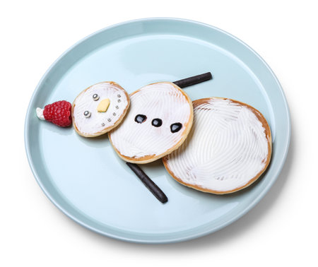 Plate with tasty pancakes in shape of snowman on white backgroundの写真素材