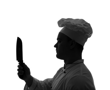 Silhouette of male chef with knife on white backgroundの写真素材