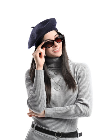 Beautiful young woman in stylish hat on white backgroundの写真素材