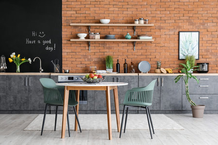 Interior of stylish kitchen with dining tableの写真素材