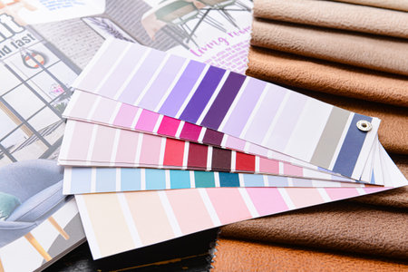 Paint color palettes with fabric samples and magazine, closeupの写真素材
