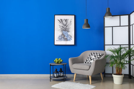 Interior of stylish living room with comfortable armchairの写真素材