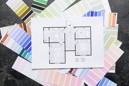 Plan of house and color samples on dark background