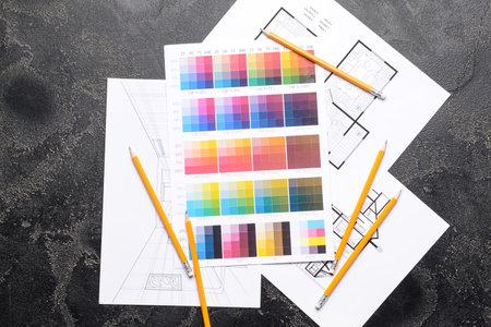 Plan of house, color samples and pencils on dark backgroundの写真素材