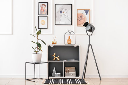 Interior of stylish living room with lamp and picturesの写真素材