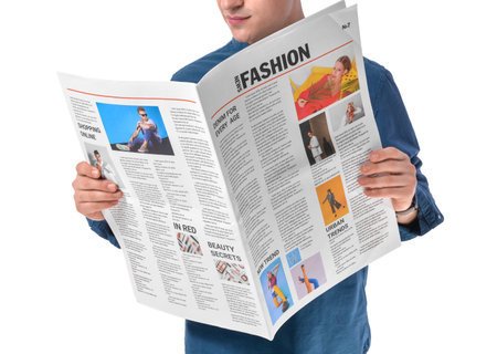 young man reading newspaper on white backgroundの写真素材