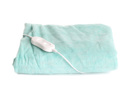 Green electric heating pad with controller on white backgroundの写真素材