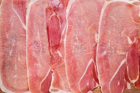 Slices of ham as background, closeupの写真素材
