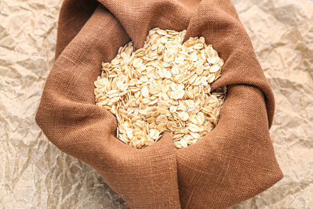 Napkin with raw oatmeal on baking paper