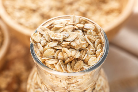 Bottle of raw oat flakes, closeupの写真素材