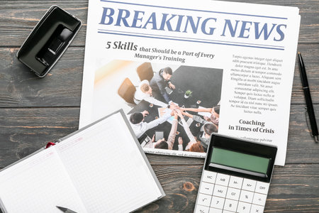 Composition with newspaper and notebook on dark wooden backgroundの写真素材