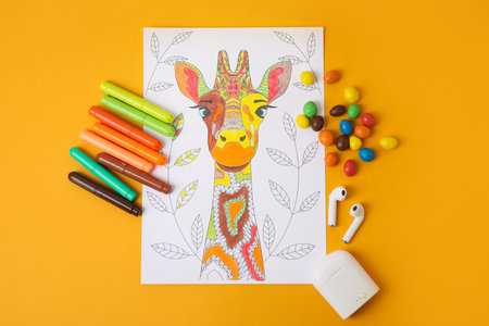 Composition with coloring picture on tableの写真素材