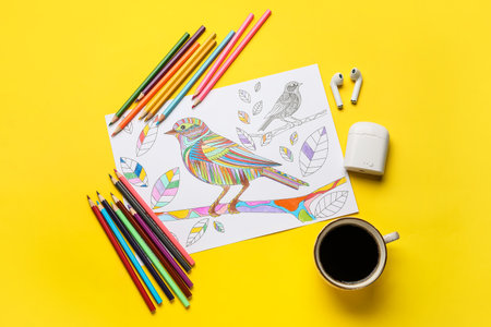 Composition with coloring picture on tableの写真素材