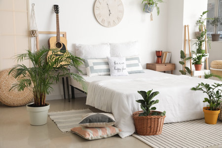 Interior of stylish bedroom with plants