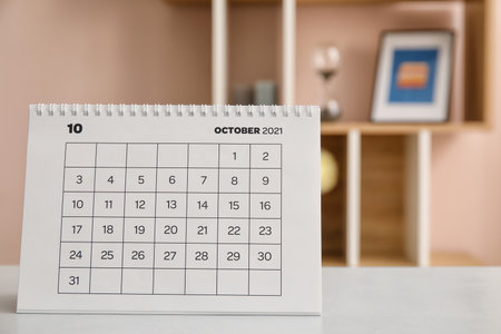 Flip paper calendar on table in officeの写真素材