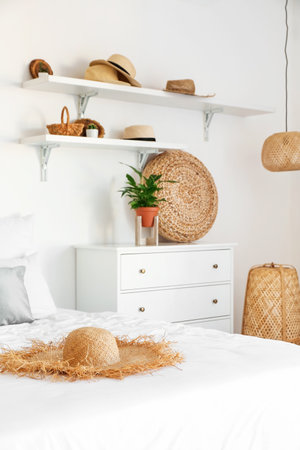 Interior of stylish bedroom with hats