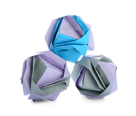 Origami flowers on white background. concept of uniquenessの写真素材