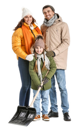 Family with shovel for removing snow on white backgroundの写真素材