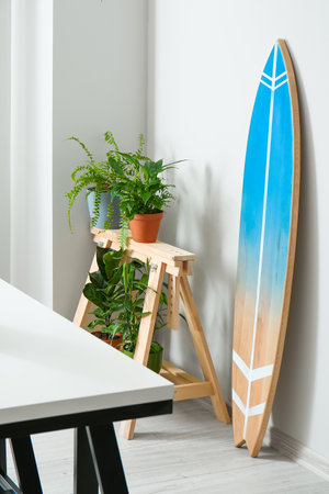 Interior of modern stylish room with surfboardの写真素材