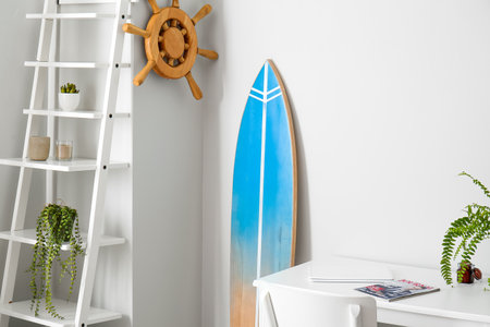 Interior of modern stylish room with table and surfboardの写真素材