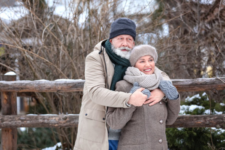 Happy mature couple outdoors on winter dayの写真素材
