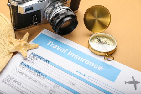 Composition with travel insurance and compass on color background, closeupの写真素材