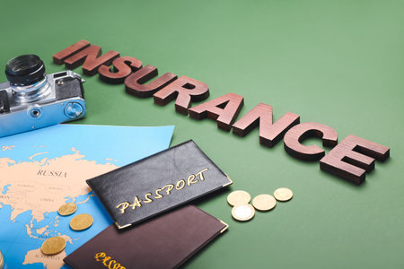 Composition with word INSURANCE and passports on color background, closeupの写真素材