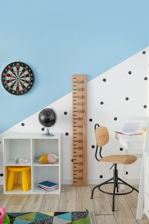 Stylish interior of modern children's room with stadiometerの写真素材