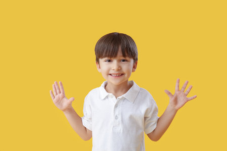 Cute little boy on color backgroundの写真素材