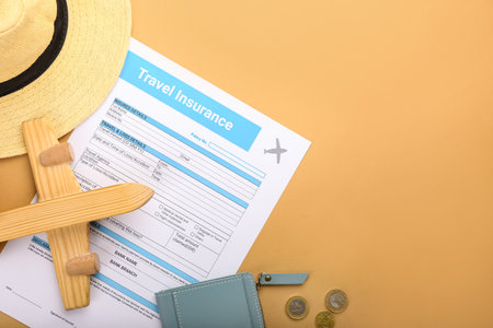 Composition with travel insurance and plane figure on color backgroundの写真素材