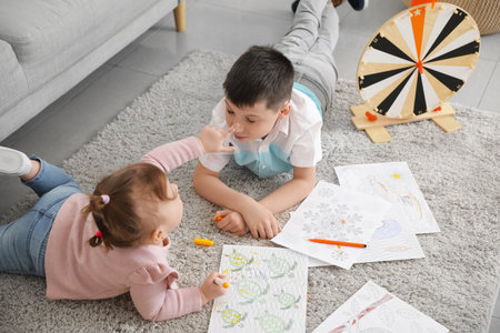 Cute little children drawing at homeの写真素材