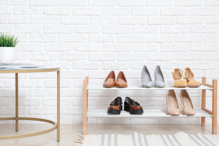 Stand with shoes in modern hallの写真素材