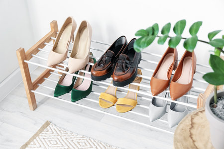 Stand with shoes in modern hallの写真素材