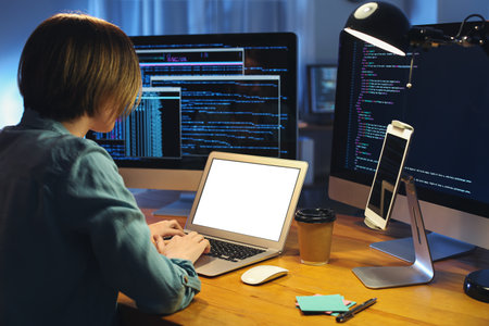 Female programmer working in office at night